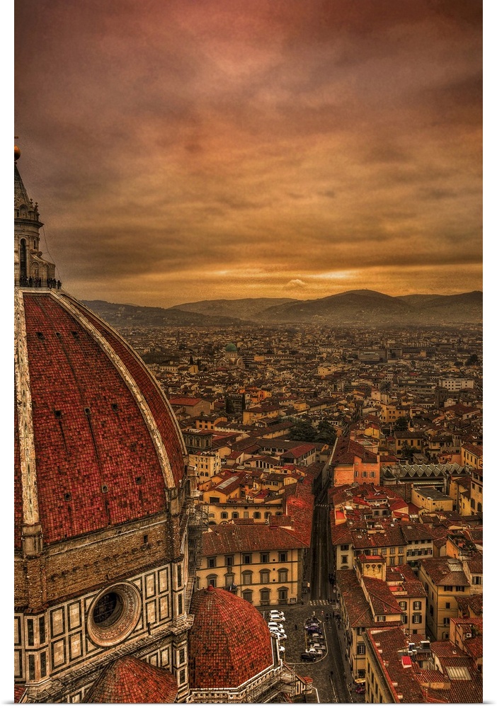 Tall canvas photo of vintage Italian buildings with rolling mountains in the distance.