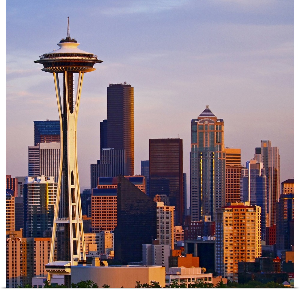 The Space Needle is a tower at dusk in Seattle, Washington.