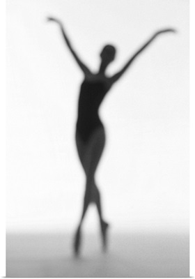 toned silhouette of a young woman performing ballet