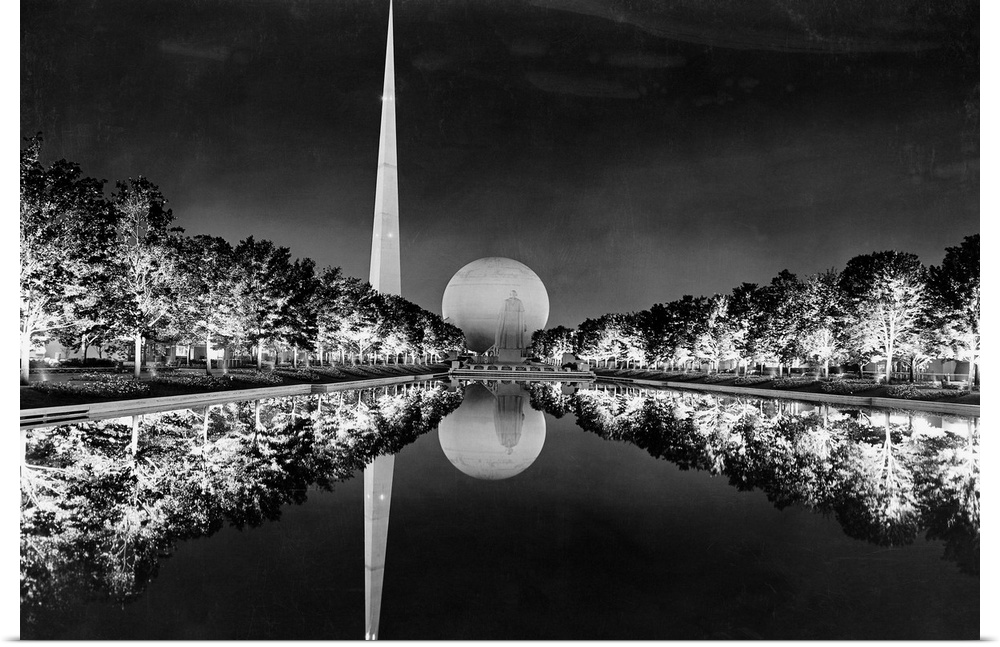 Trees illuminated with General Electric E-3 Novalux floodlights are reflected on the Constitutional Mall reflection pool a...