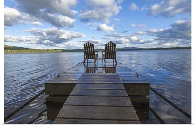 Two adirondack chair on a dock at Spencer Pond in northern Maine