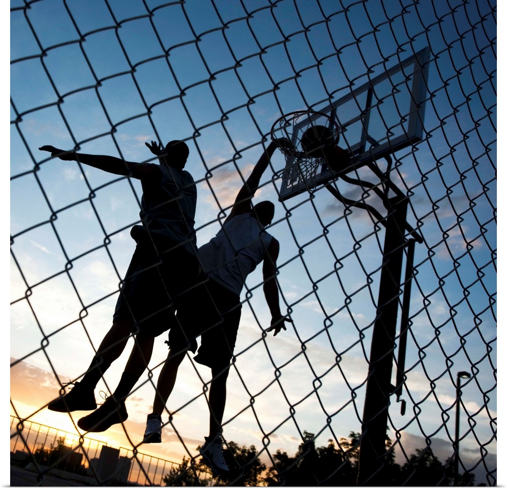 USA, Utah, Salt Lake City, two young men playing street basketball, low angle view