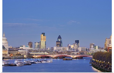 UK, London, view of city skyline and St Paul's Cathedral at dusk across River Thames