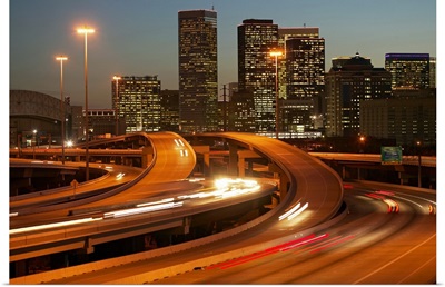 USA, Texas, Houston city skyline and motorway, dusk (long exposure)