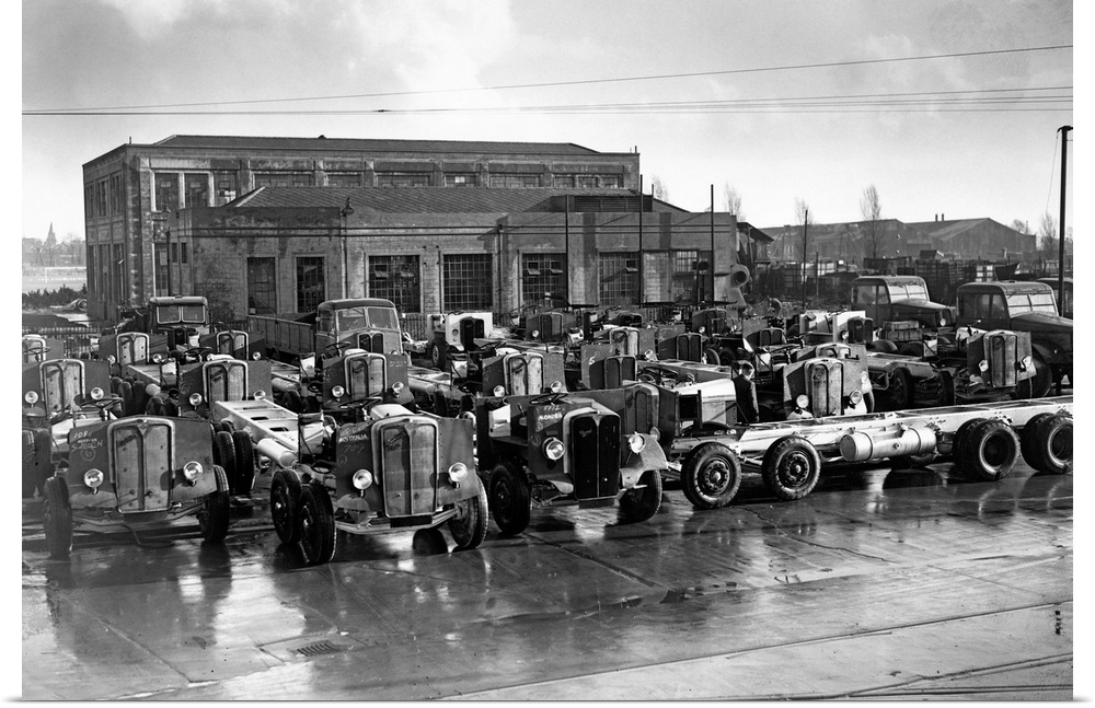 Bus and goods vehicle chassis wait outside the Associated Equipment Company factory in Southall to be exported. This compa...