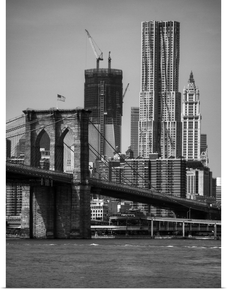 View of One World Trade Center and brooklyn bridge in New York city skyline.