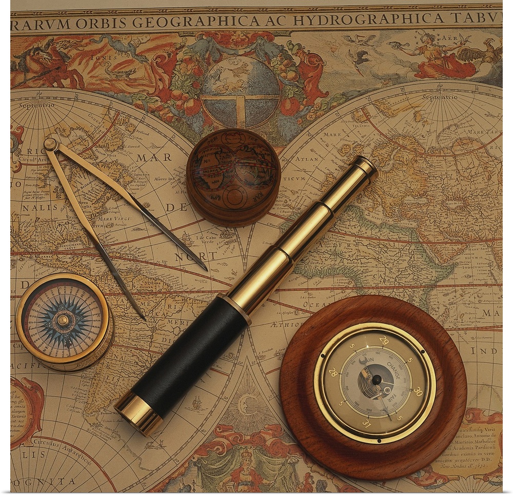 Square, oversized photograph of an antique world map with vintage navigation tools such as a compass, divider and telescop...