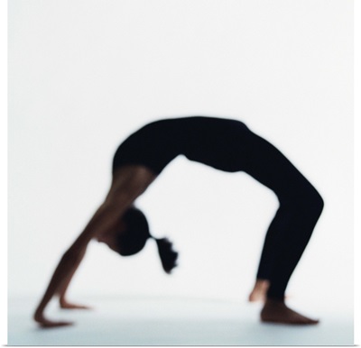 Woman in yoga backbend pose