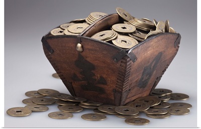 Wooden box full of ancient Chinese coins