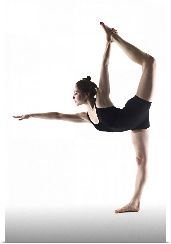 Young woman standing yoga pose on white background.