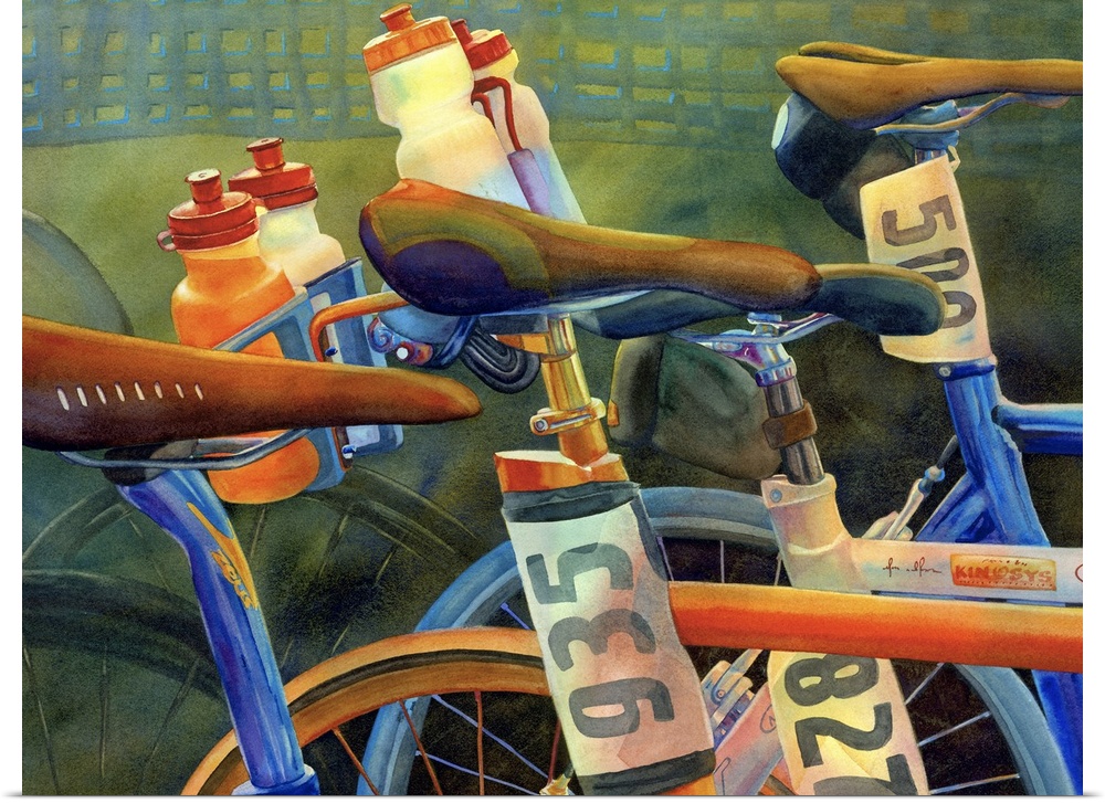 Landscape artwork on a big canvas of a partial view of several bicycles, lined up for a race, with numbers on paper just b...