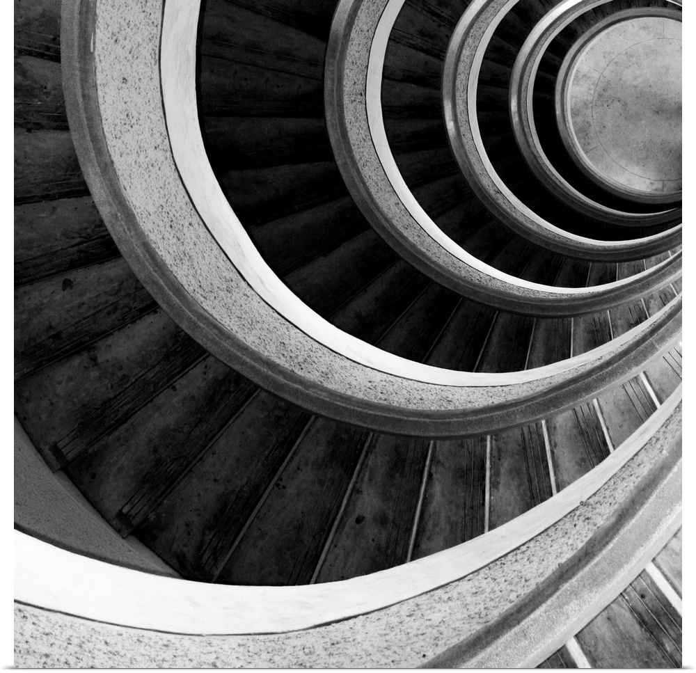 A spiral staircase inside a tower looking down