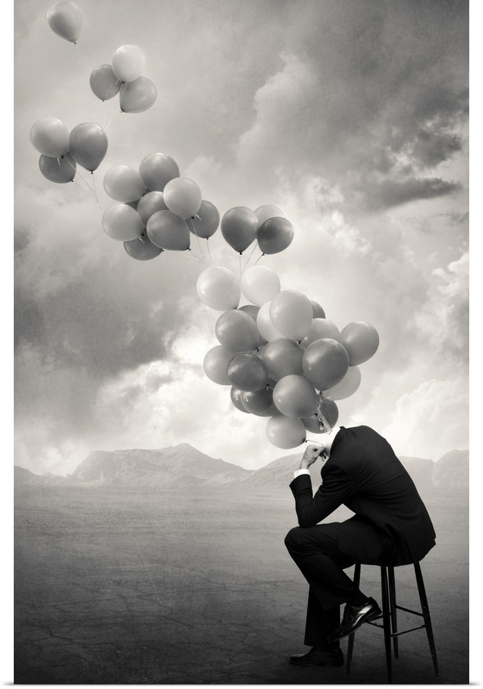 An abstract art photograph of a hollow business suit seated on a stool, with balloons hovering out of the neck.