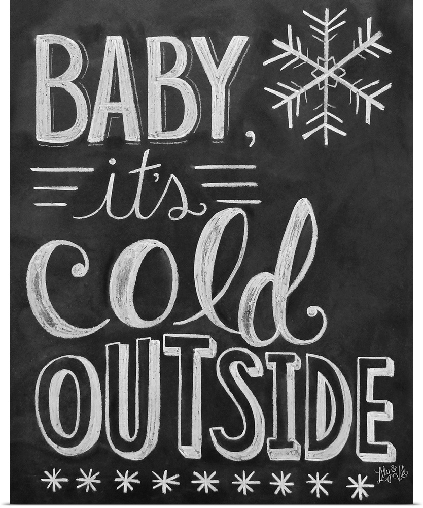 "Baby, it's cold outside" handwritten in white chalk on a black background.