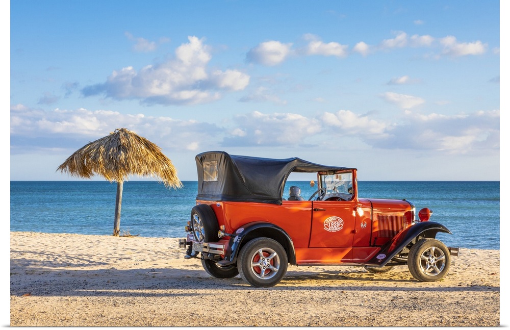 A classic car on a beach in Playa Ancoa, in Trinidad, Sancti Spiritus, Cuba