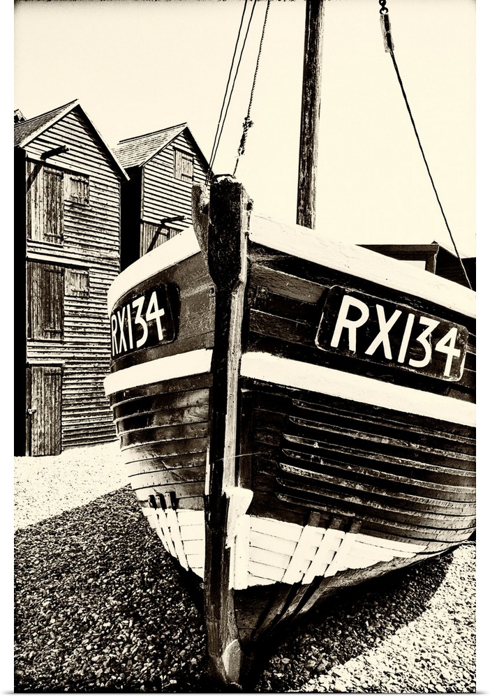 A fishing boat and the net shops ( a weather-proof storage for the fishing gear), Hasting Old Town, Sussex, England.