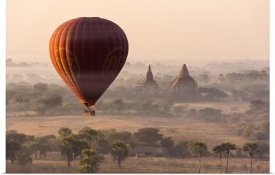 A hot-air balloon flying over pagodas in Bagan, Myanmar.