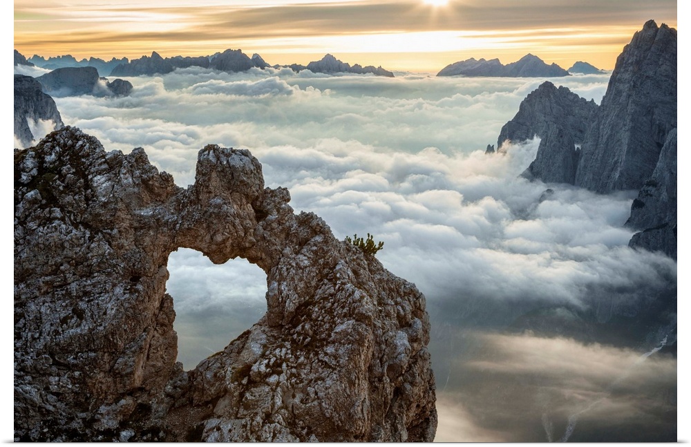 A rock's heart, on a cloud's sea, between rock walls. (Dolomites, Italy).