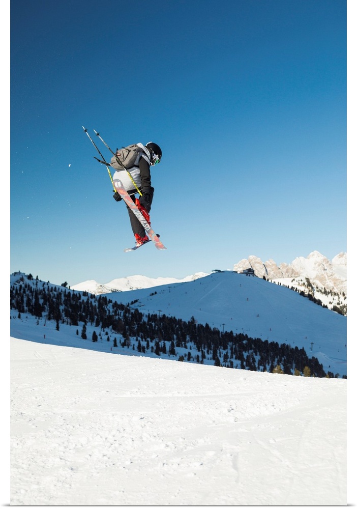 A View Of A Freestyler Flying With His Skis After A Jump In Val Gardena, Bolzano Province, South Tyrol, Trentino Alto Adig...