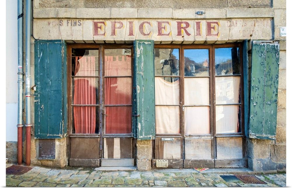 Abandoned storefront vintage painted sign of old Epicerie market store, Aubusson, La Creuse Department, Limousin, France.
