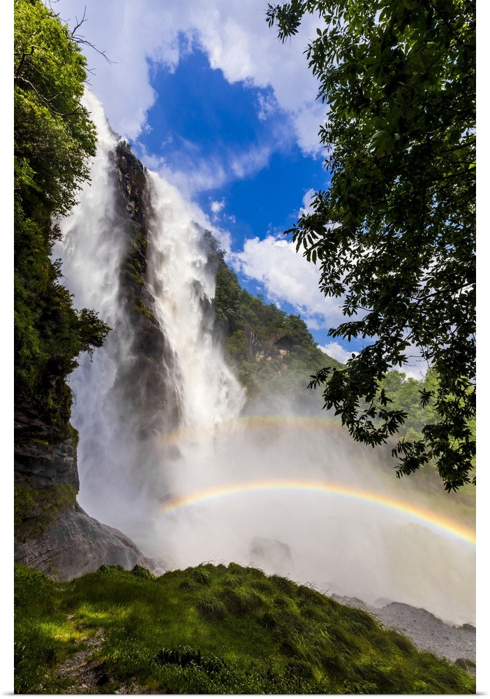 Acquafraggia Waterfall in spring with a rainbow. Valchiavenna, Valtellina, Lombardy, Italy, Europe.