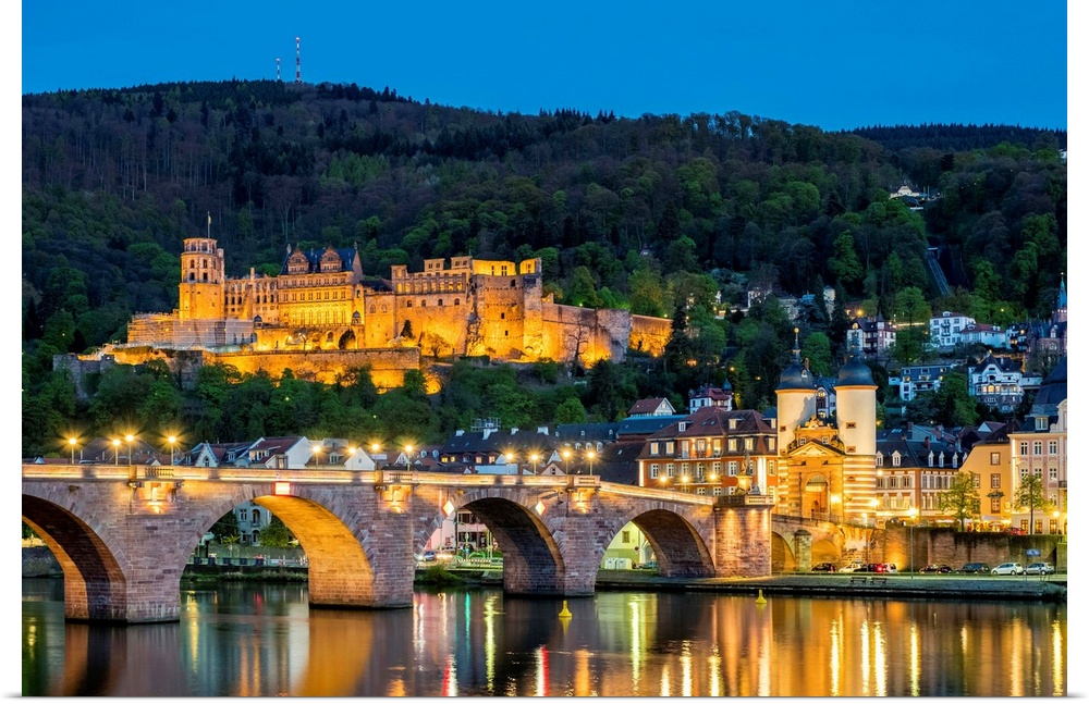 Germany, Baden-Wurttemberg, Heidelberg. Alte Brucke (old bridge) and Schloss Heidelberg castle on the Neckar River at night.