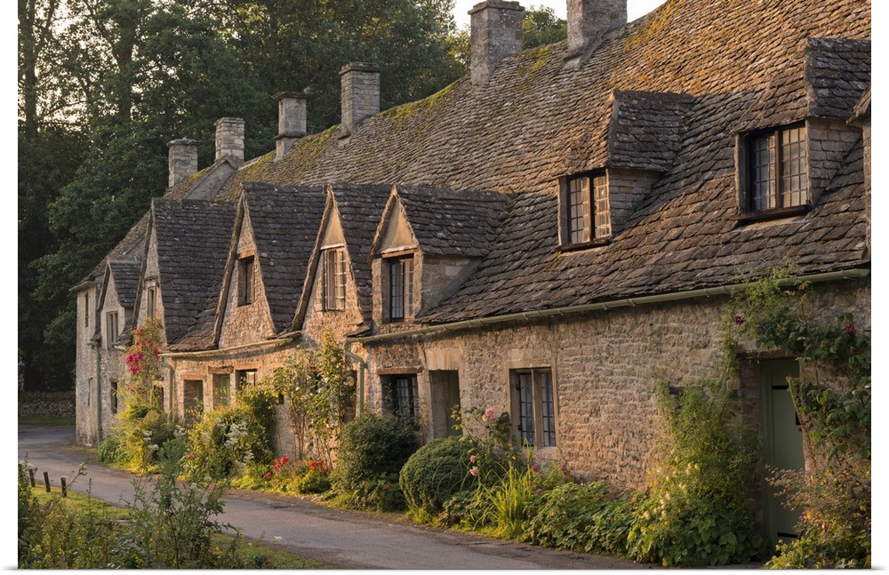 Picturesque cottages at Arlington Row in the Cotswolds village of Bibury, Gloucestershire, England. Summer (July)