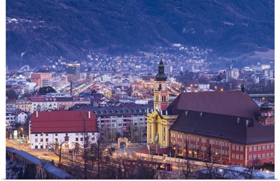 Austria, Tyrol,  Innsbruck, elevated view of the Wilten Abbey Church, dawn, winter