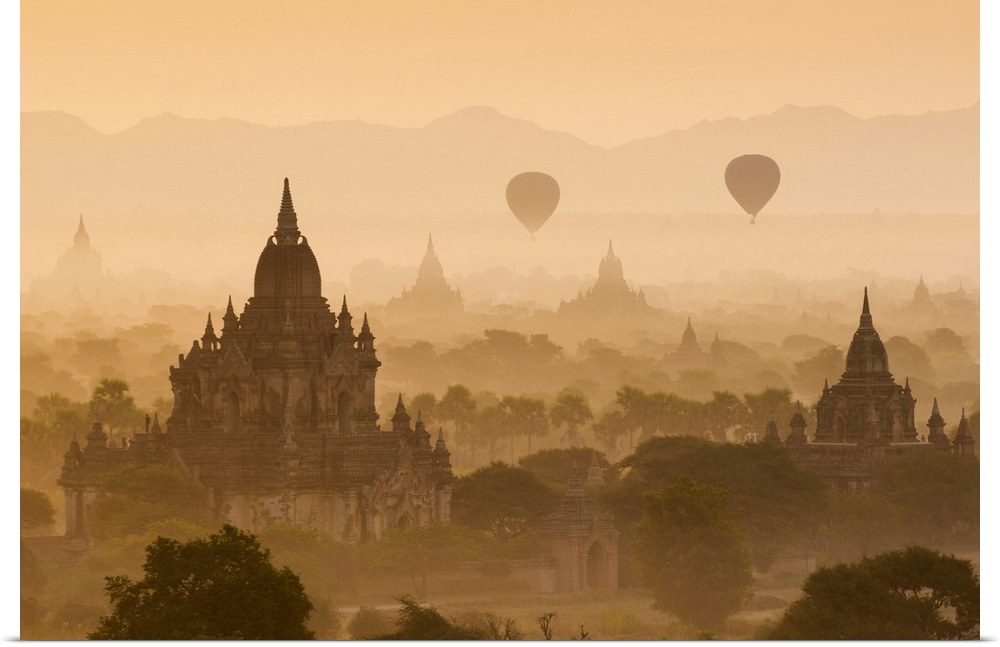 Bagan, Mandalay region, Myanmar (Burma). Pagodas and temples with balloons at sunrise.