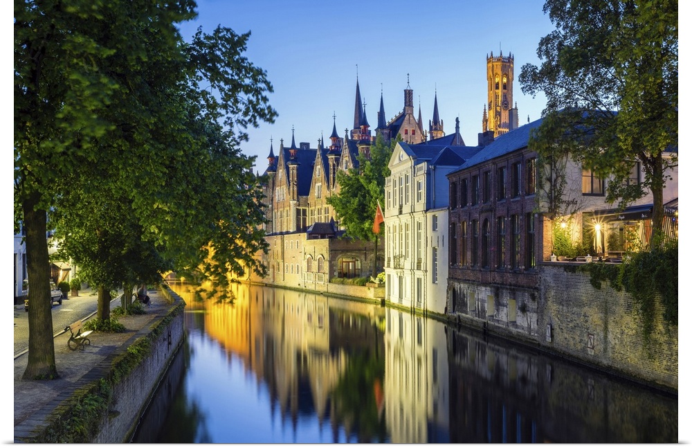 Belgium, West Flanders (Vlaanderen), Bruges (Brugge). Buildings along the Groenerei canal at dusk.