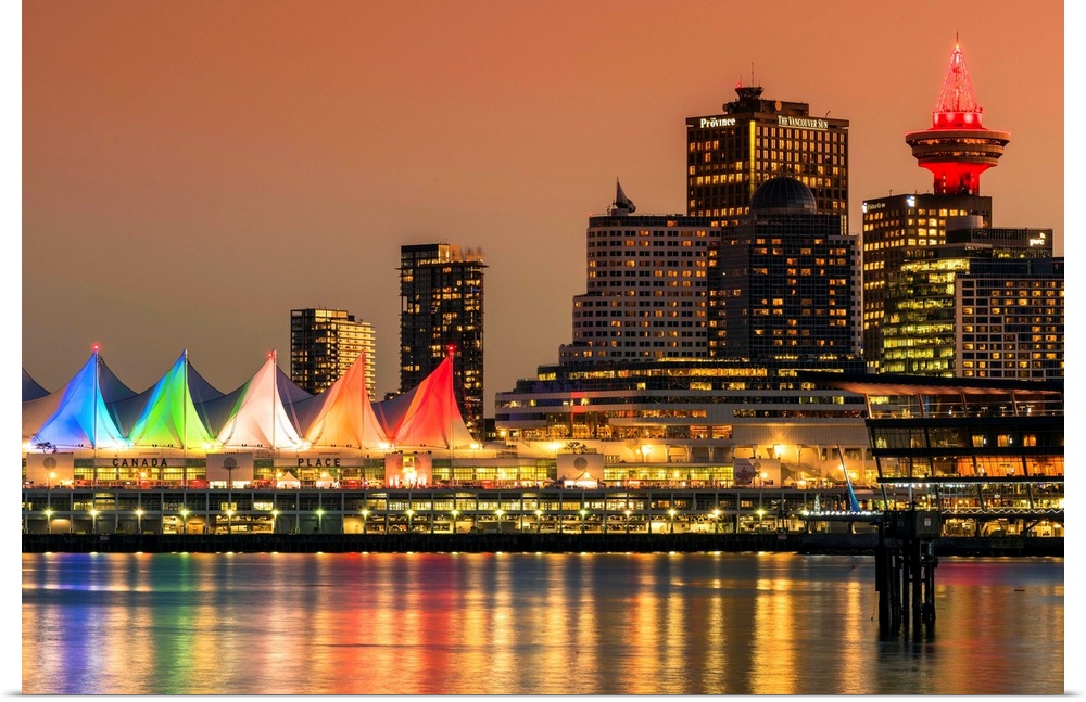 View at sunset of Canada Place and Harbour Centre building decorated with Christmas lights, Vancouver, British Columbia, C...