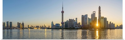 China, Shanghai, Skyline of the Financial District across Huangpu River at sunrise