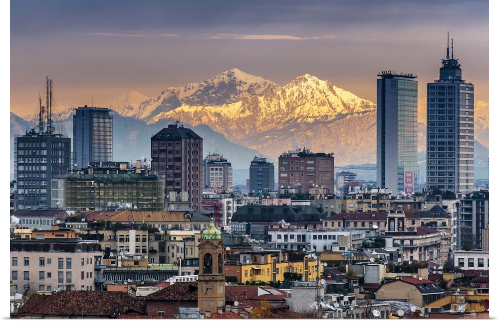 City skyline at sunset with the snowy Alps in the background, Milan, Lombardy, Italy