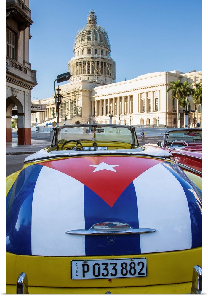 Classic American car with the Cuban flag painted in it's boot, Parque Central, Havana, Cuba.