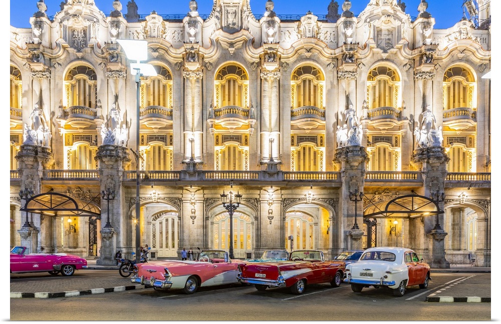 Classic cars parked in front of the Gran Teatro de La Habana (otherwise known as Grand Theatre of Havana) at night, Centro...