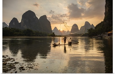 Cormorant Fisherman Throwing Net On Li River At Dawn, Xingping, Yangshuo, Guangxi, China