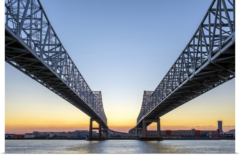 United States, Louisiana, New Orleans. Crescent City Connection, twin span bridges over the Mississippi River at sunset.