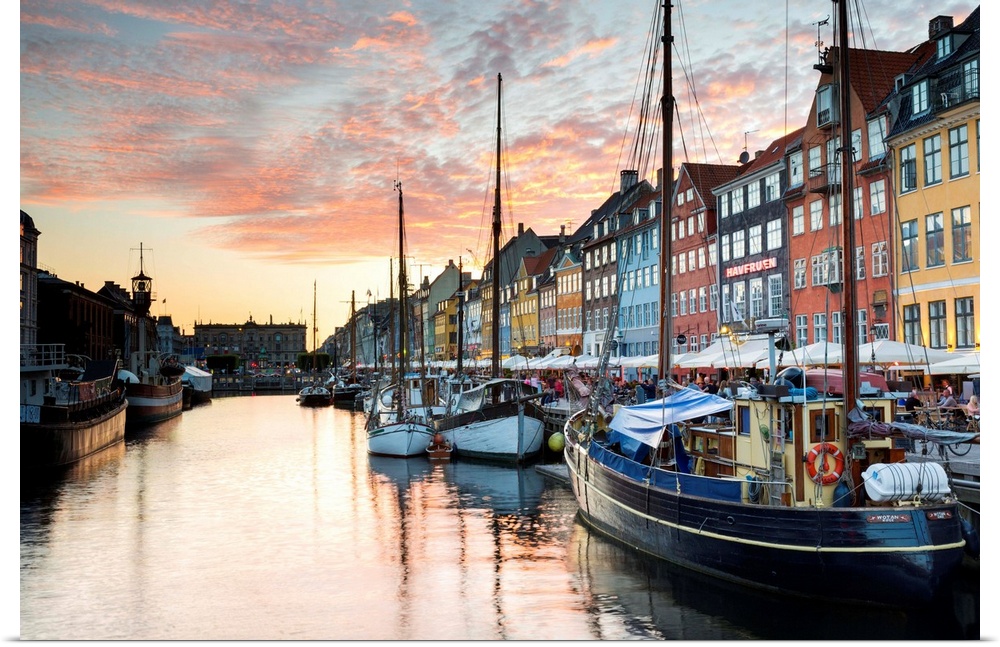 Denmark, Hillerod, Copenhagen. Colourful buildings along the 17th century waterfront of Nyhavn at sunset.
