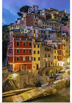Dusk view of the colorful sea village of Riomaggiore, Cinque Terre, Liguria, Italy