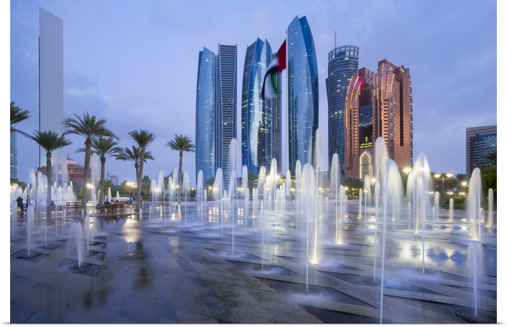 Etihad Towers time lapse viewed over the fountains of the Emirates Palace Hotel, Abu Dhabi, United Arab Emirates, Middle East