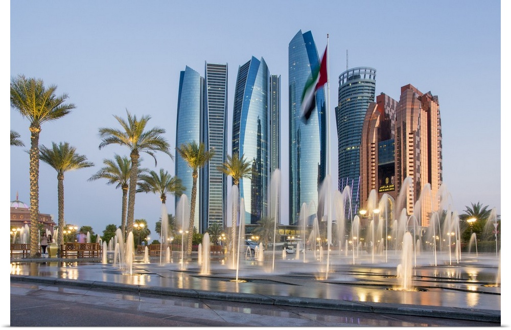 Etihad Towers time lapse viewed over the fountains of the Emirates Palace Hotel, Abu Dhabi, United Arab Emirates, Middle East