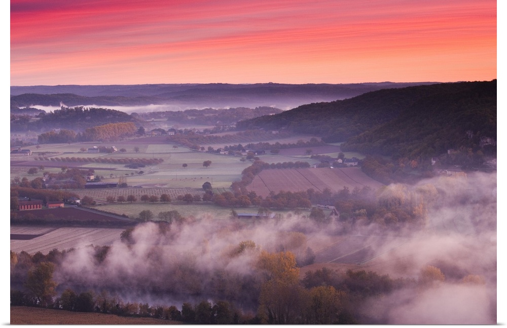 France, Aquitaine Region, Dordogne Department, Domme, elevated view of the Dordogne River Valley in fog from the Belvedere...