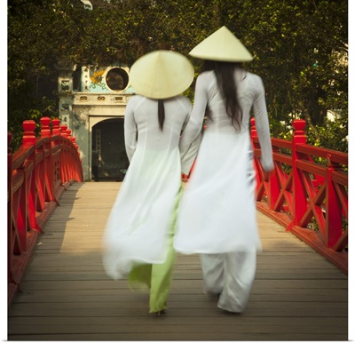 Girls wearing Ao Dai dress, Huc Bridge, Hoan Kiem Lake, Hanoi, Vietnam