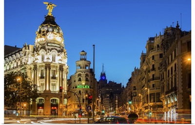 Gran Via street and Metropolis Building with car light trails, Madrid, Spain