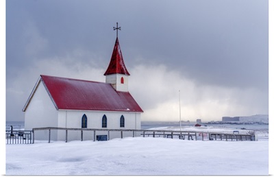 Iceland: The Little Church Of Reynisfjara Looking At The Storm On The Seashore