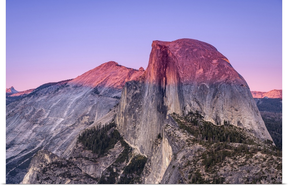 Idyllic view of Half Dome granite rock formation at Yosemite National Park during sunset, Sierra Nevada, Central Californi...