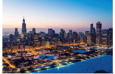 Illinois, Chicago. Aerial dusk view of the city and Millennium Park in winter