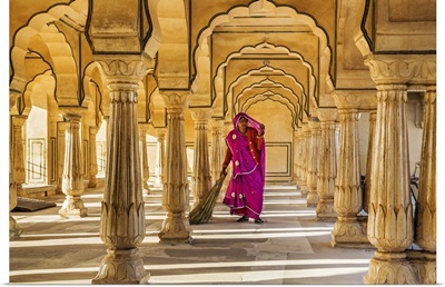 India, Rajasthan, Jaipur, Amer, A woman sweeps the floor of a pavilion in the Amber Fort