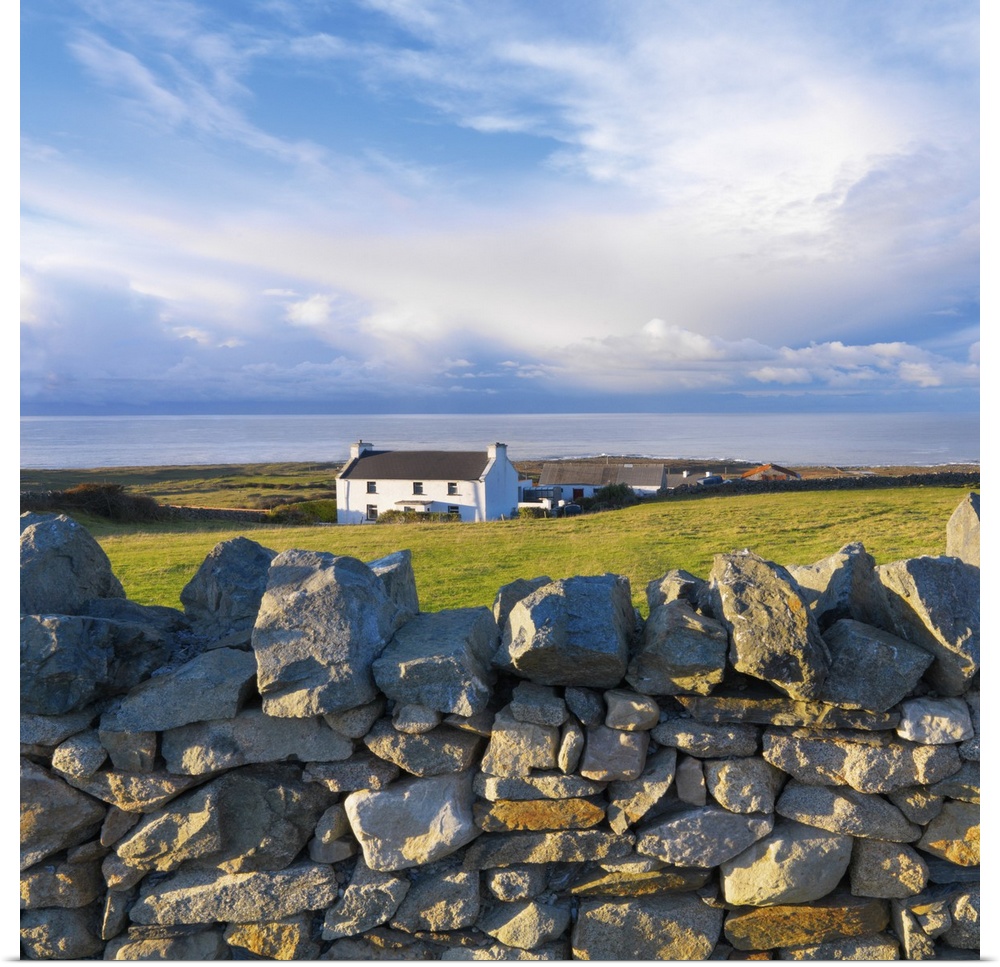 Ireland, County Donegal, Fanad, House and stone wall.