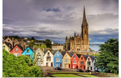 Ireland, Northern Europe; Cobh Cathedral and houses at sunset
